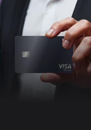 A man demonstrating a Visa card