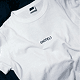 white t-shirt with minimalistic (HOTEL) text on the chest