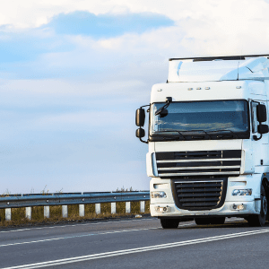 The truck is driving on the highway