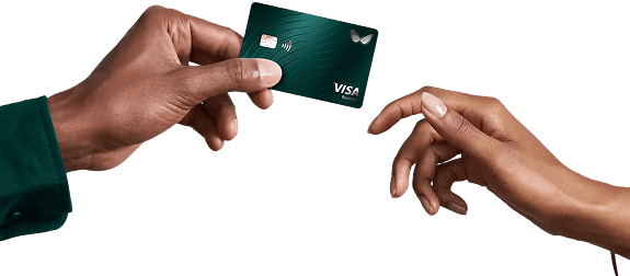 The Visa card is handed from a man’s hand to a woman’s hand